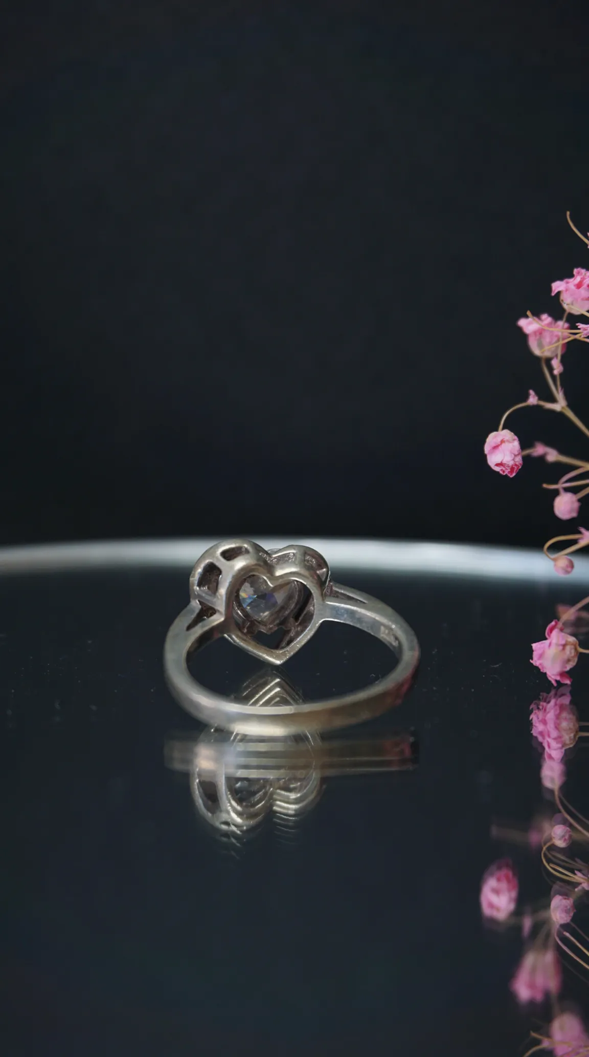 Vintage silver heart ring with clear gemstone, antique romantic jewelry.