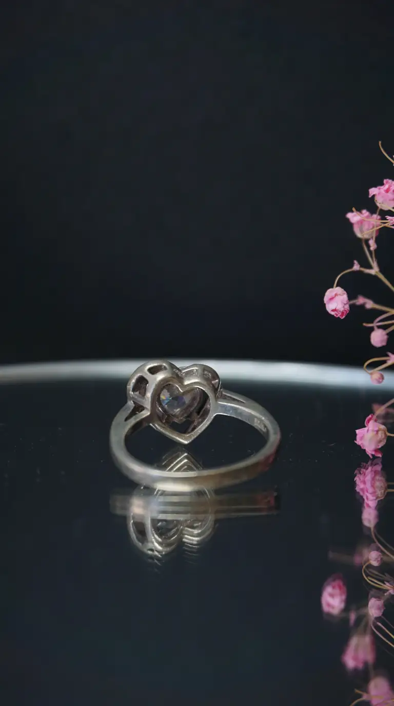 Vintage silver heart ring with clear gemstone, antique romantic jewelry.