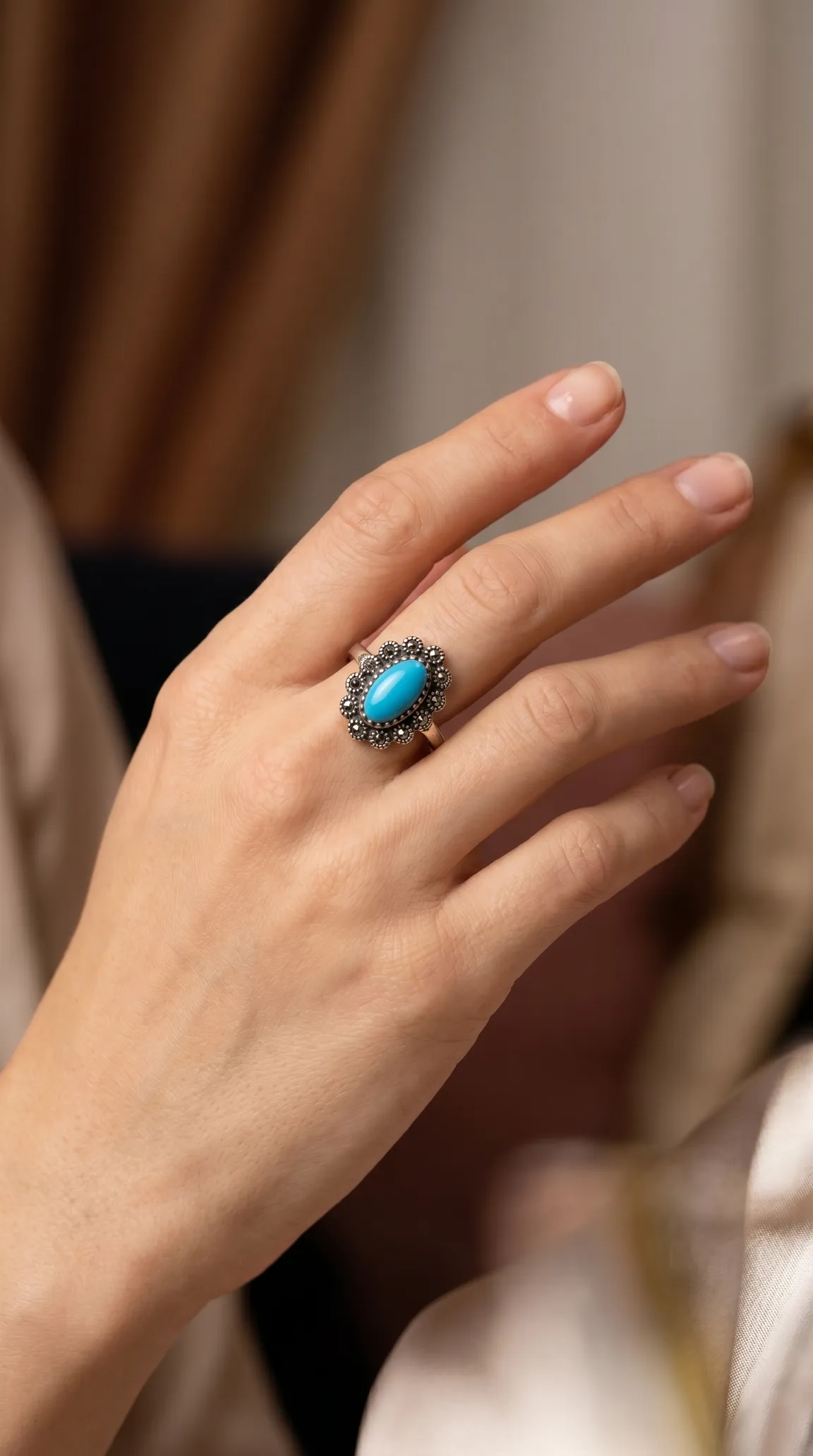 Vintage turquoise and marcasite silver ring on a woman's hand