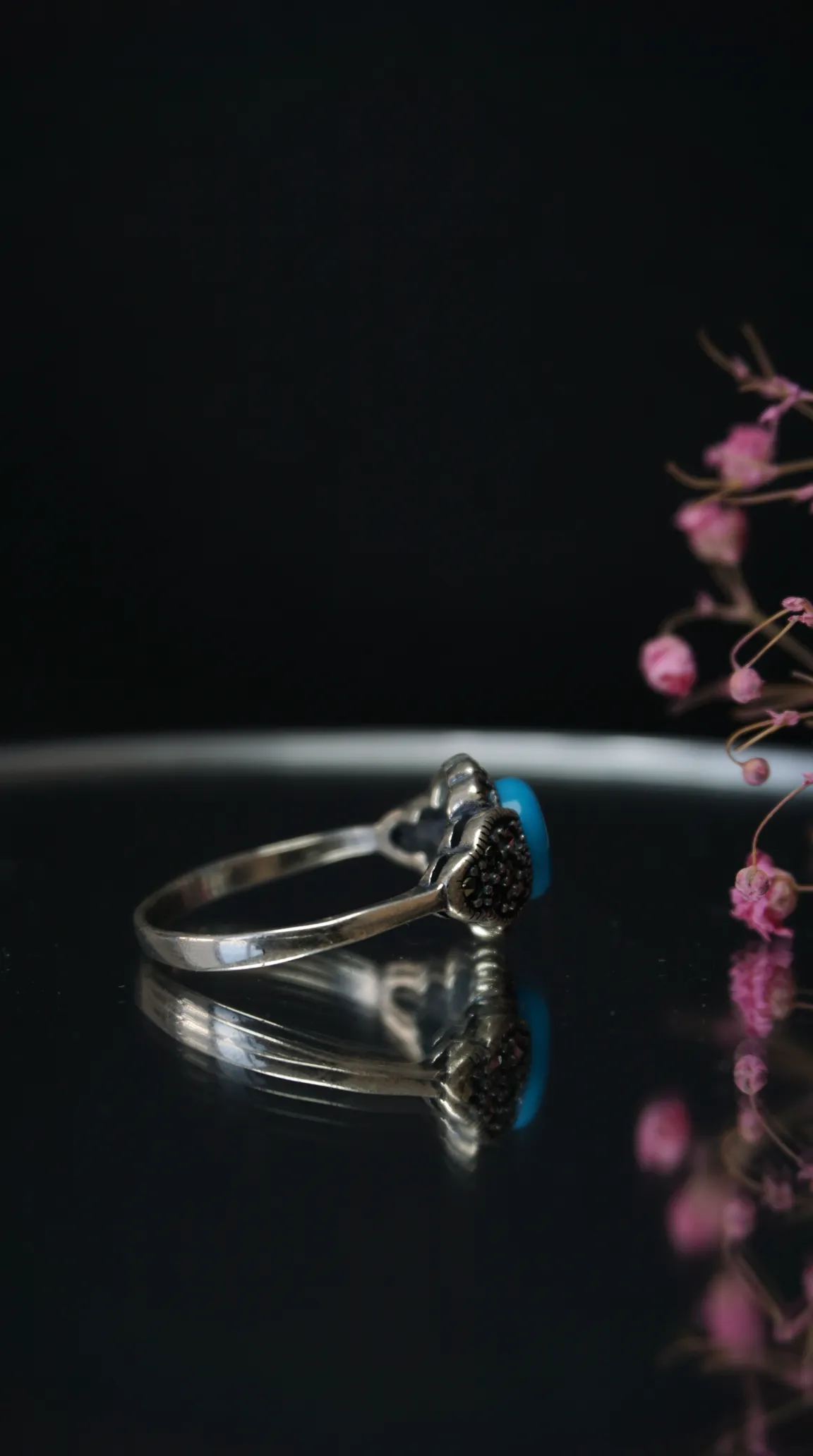 Vintage sterling silver ring with blue turquoise stone and black marcasite accents.