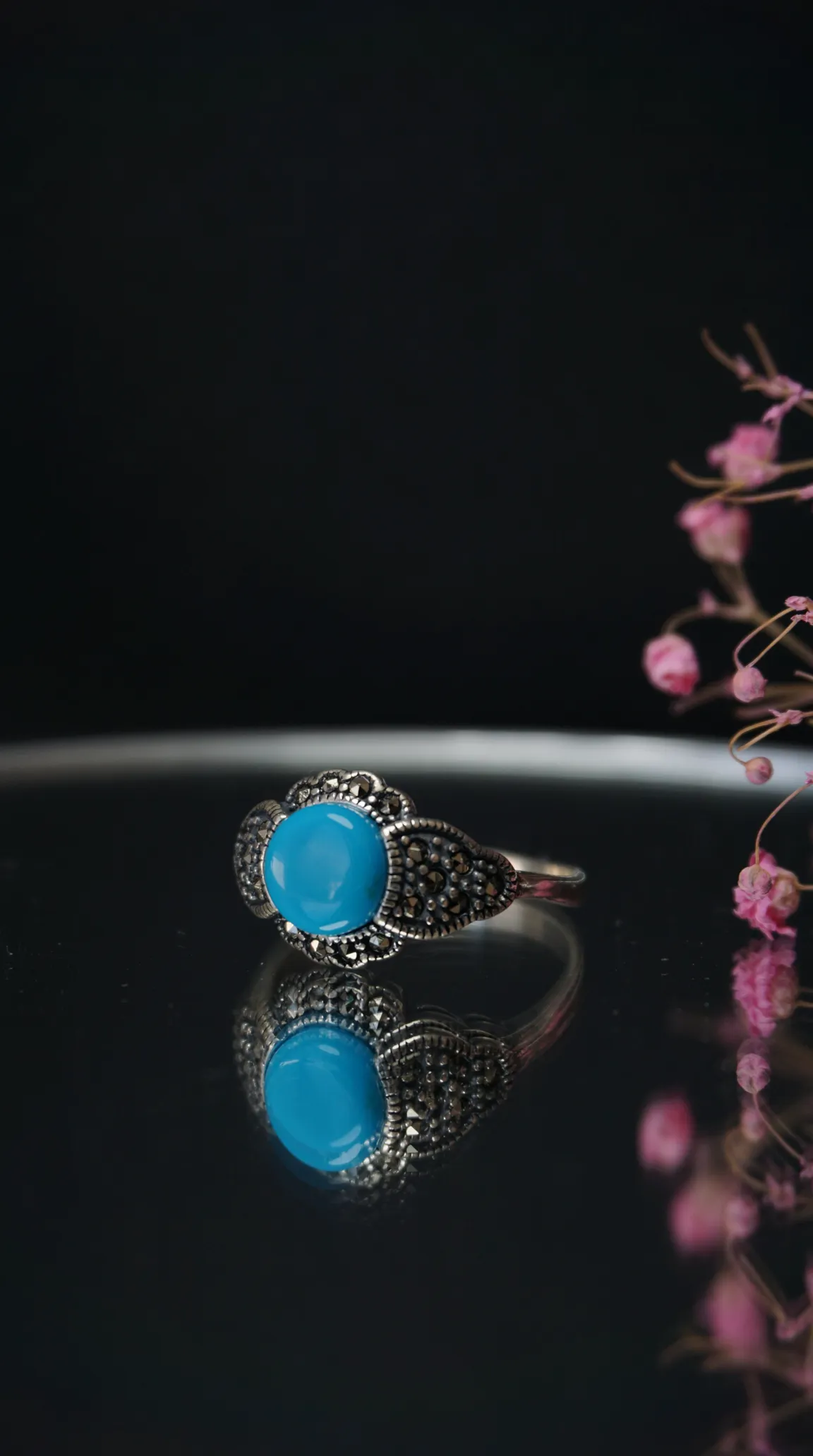 Vintage sterling silver marcasite ring with blue turquoise cabochon gemstone.