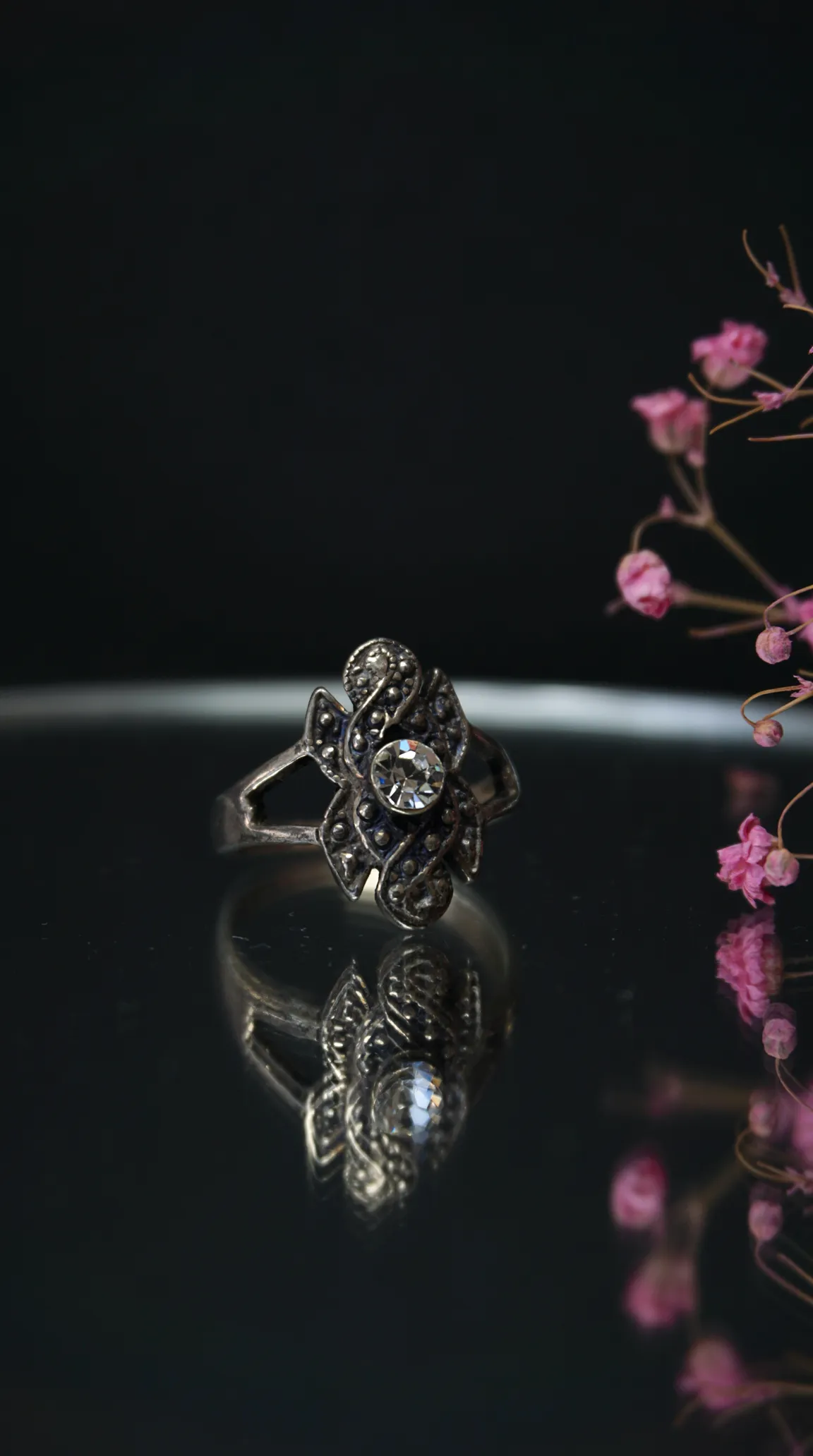 vintage ornate silver floral ring with clear crystal gemstone