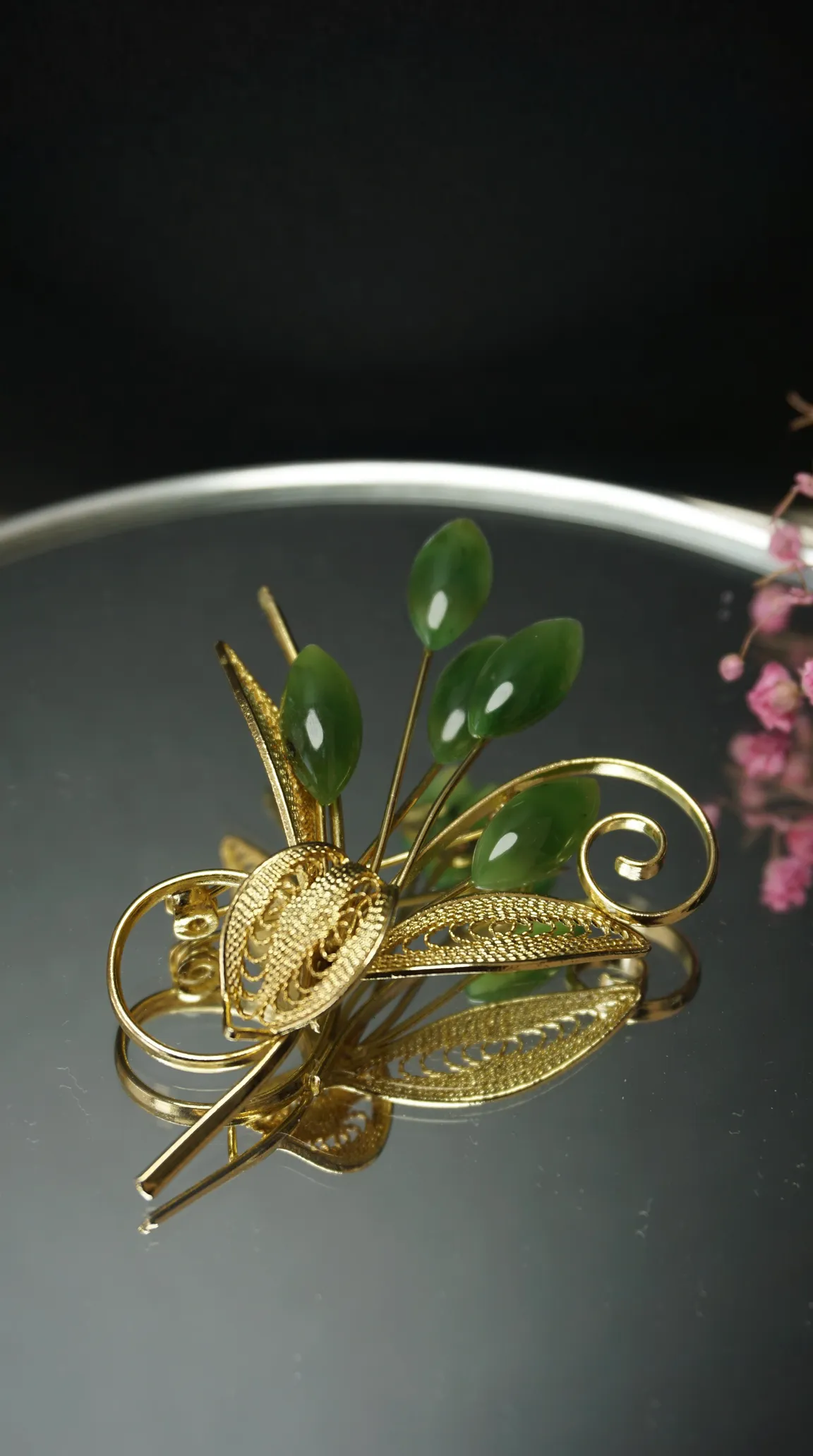 Vintage gold tone filigree brooch with green jade leaves