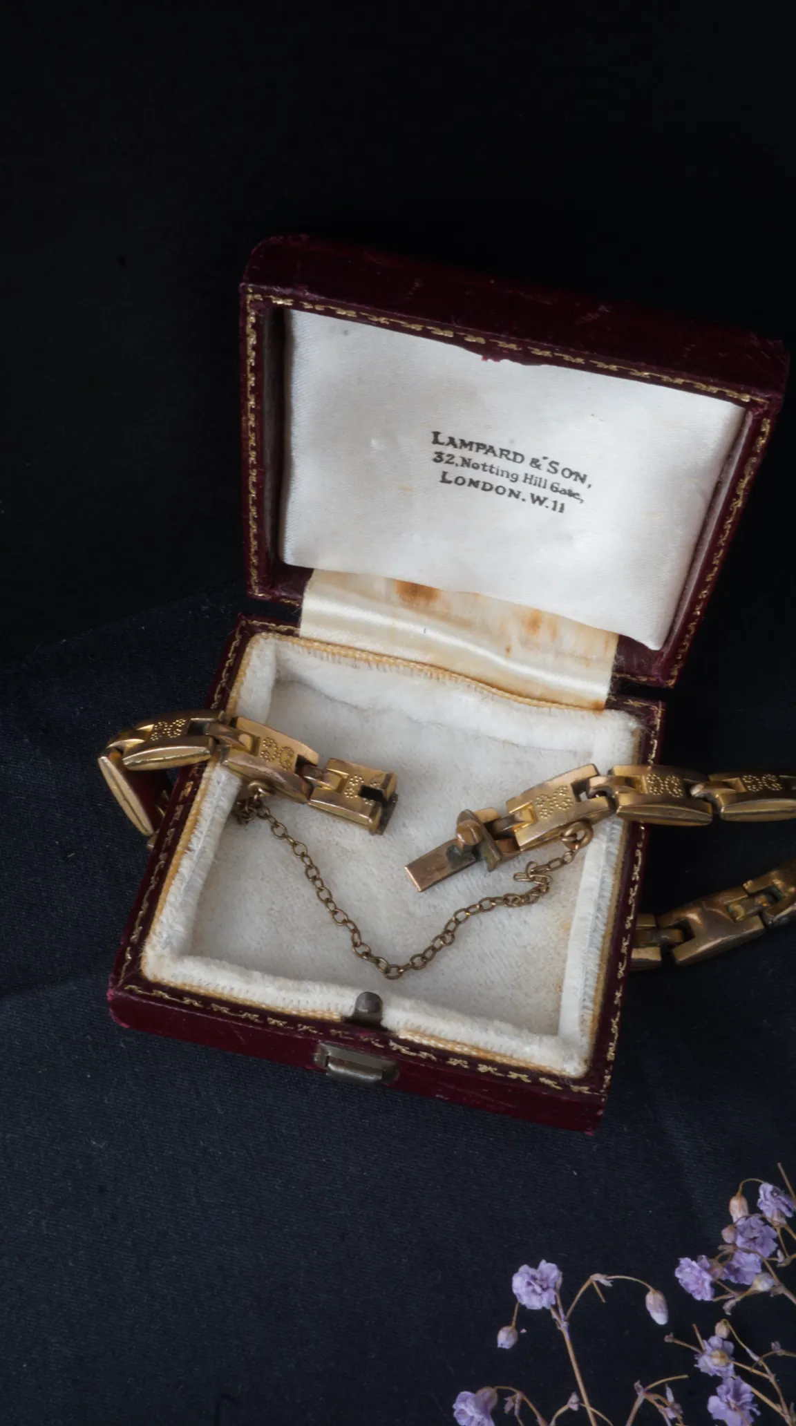 Vintage gold link bracelet with engraved details and safety chain in original red velvet Lampard & Son London presentation box