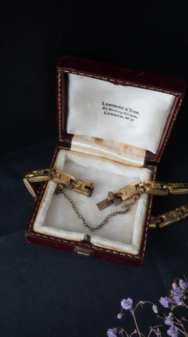 Vintage gold link bracelet with engraved details and safety chain in original red velvet Lampard & Son London presentation box
