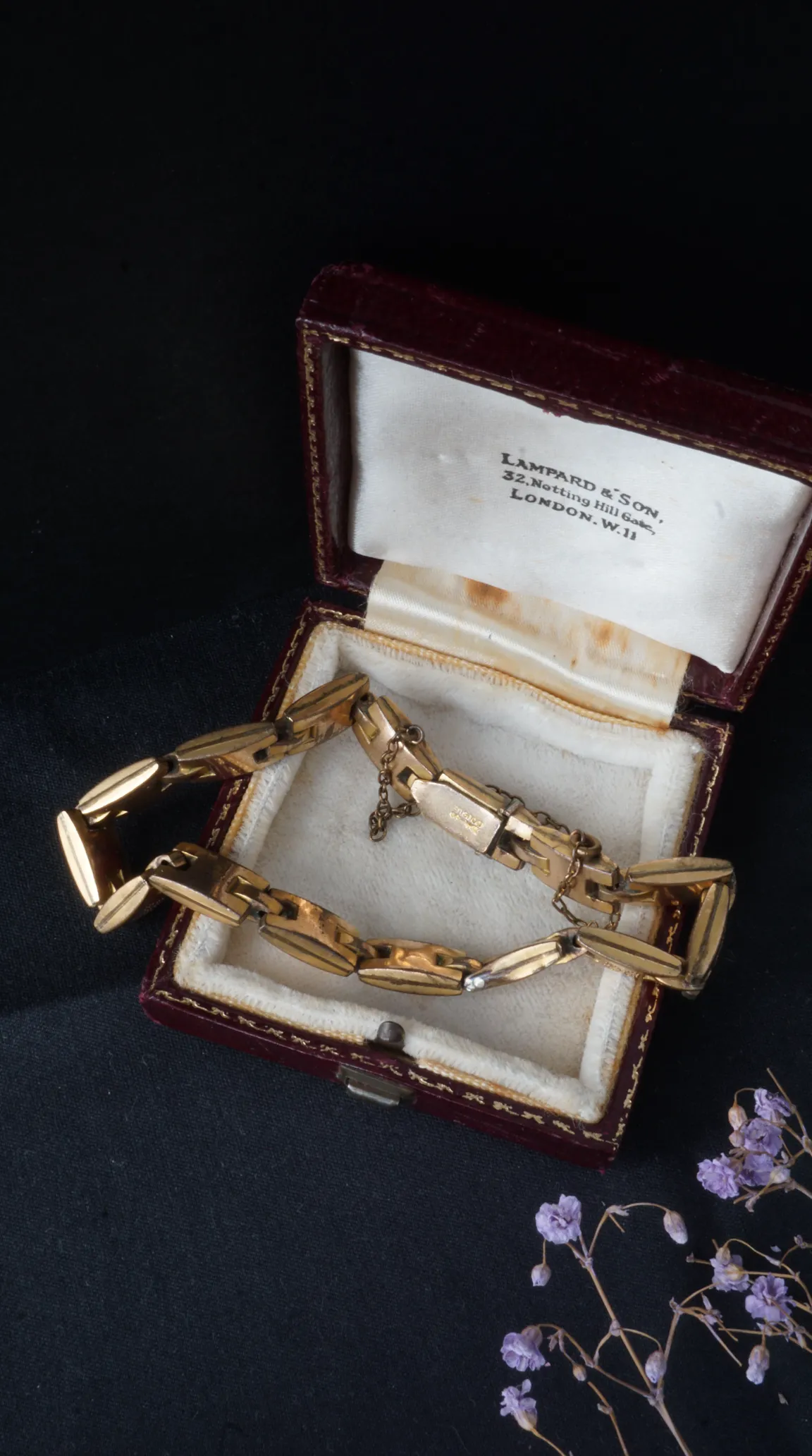 Vintage gold wide link bracelet in antique red leather Lampard & Son jewelry box, London.