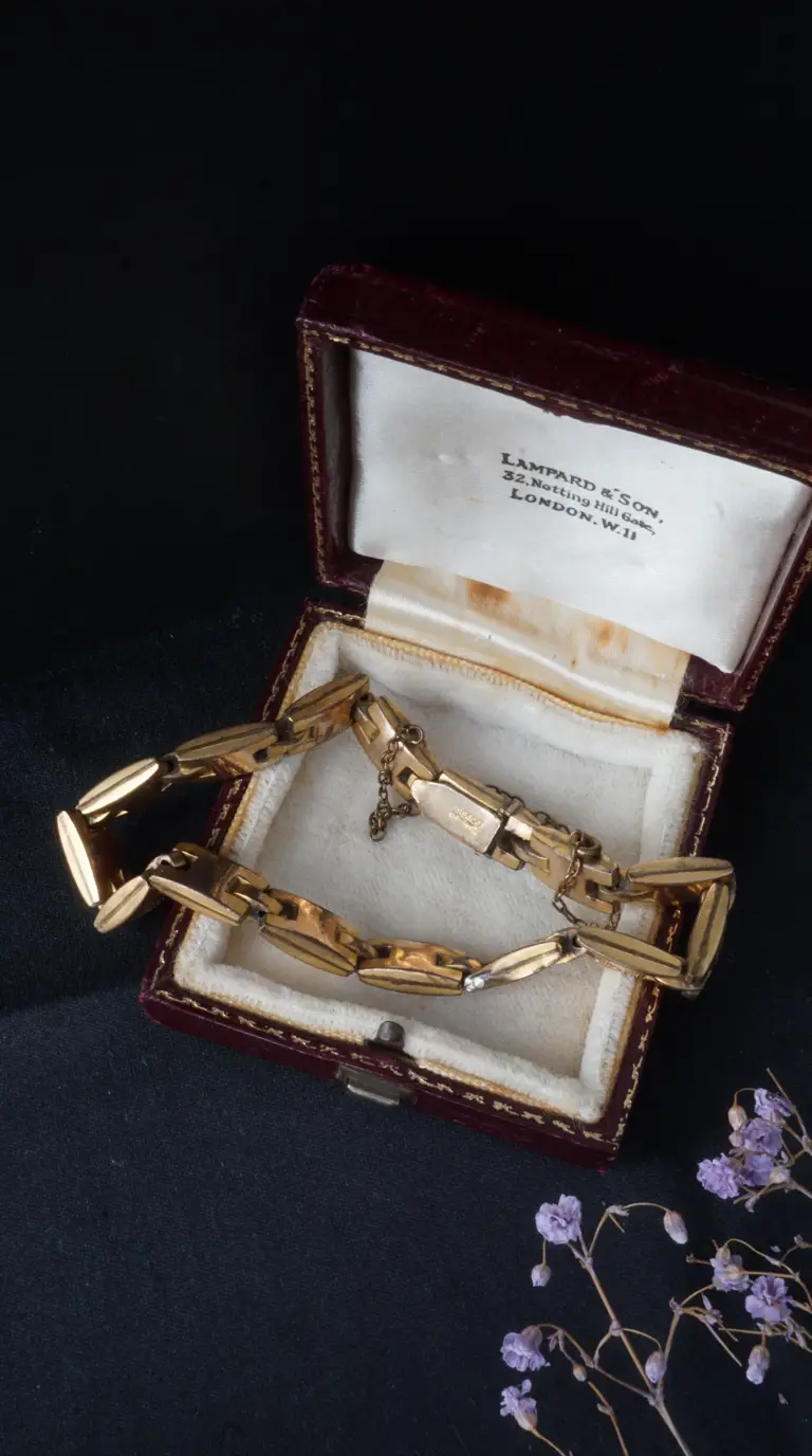 Vintage gold wide link bracelet in antique red leather Lampard & Son jewelry box, London.