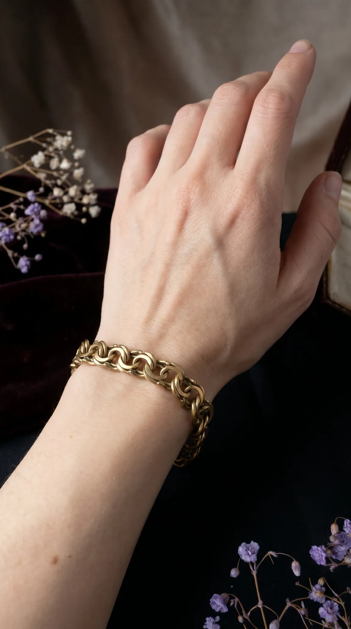 Vintage gold tone chunky chain link bracelet on a woman's wrist