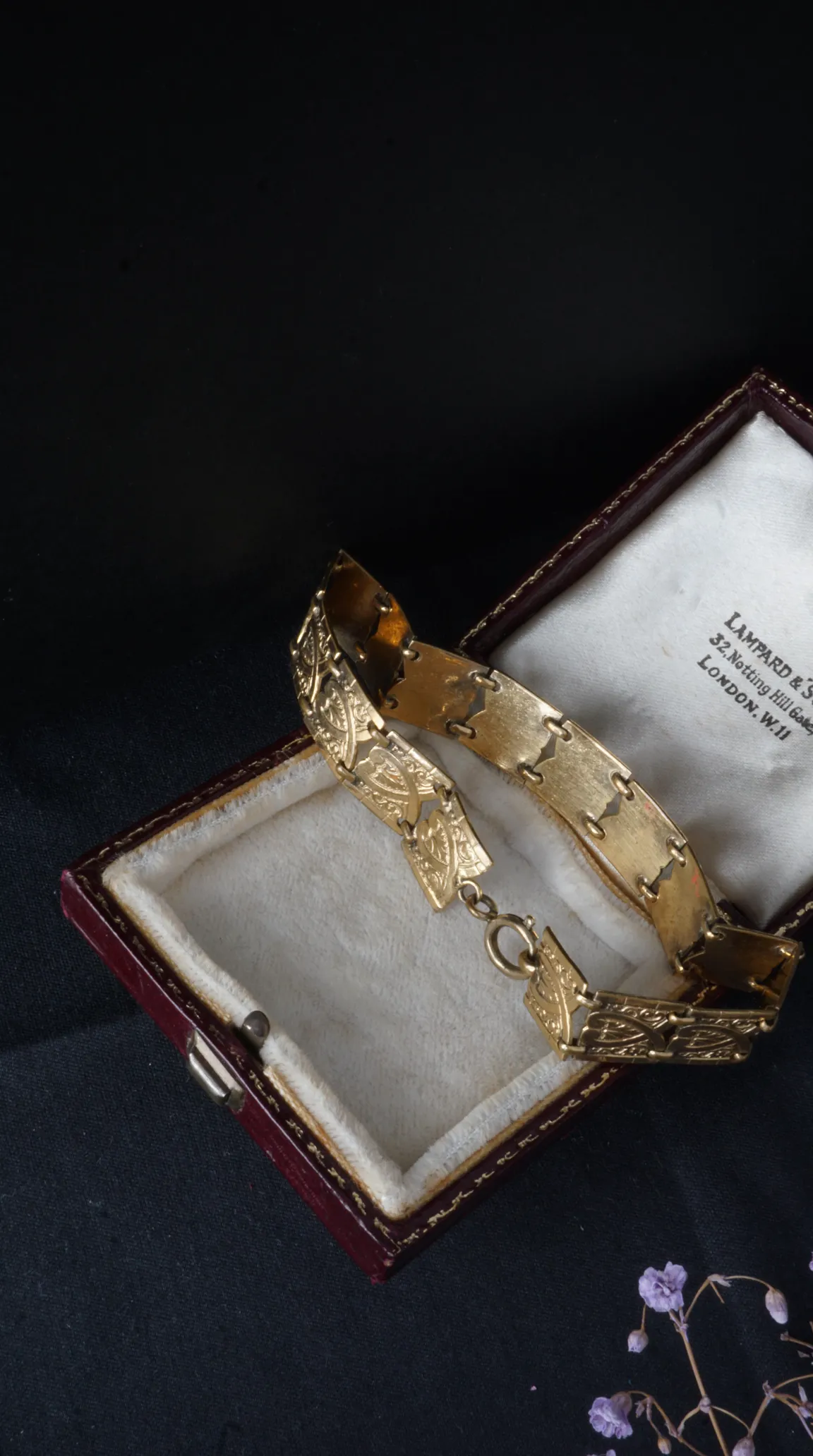 Vintage gold ornate link bracelet in antique velvet-lined jewelry box by Lampard & Sons London