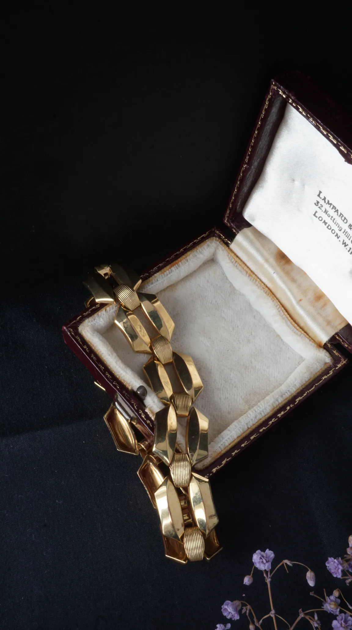 Vintage chunky gold geometric link bracelet in antique red leather jewelry box with London jeweler's mark.