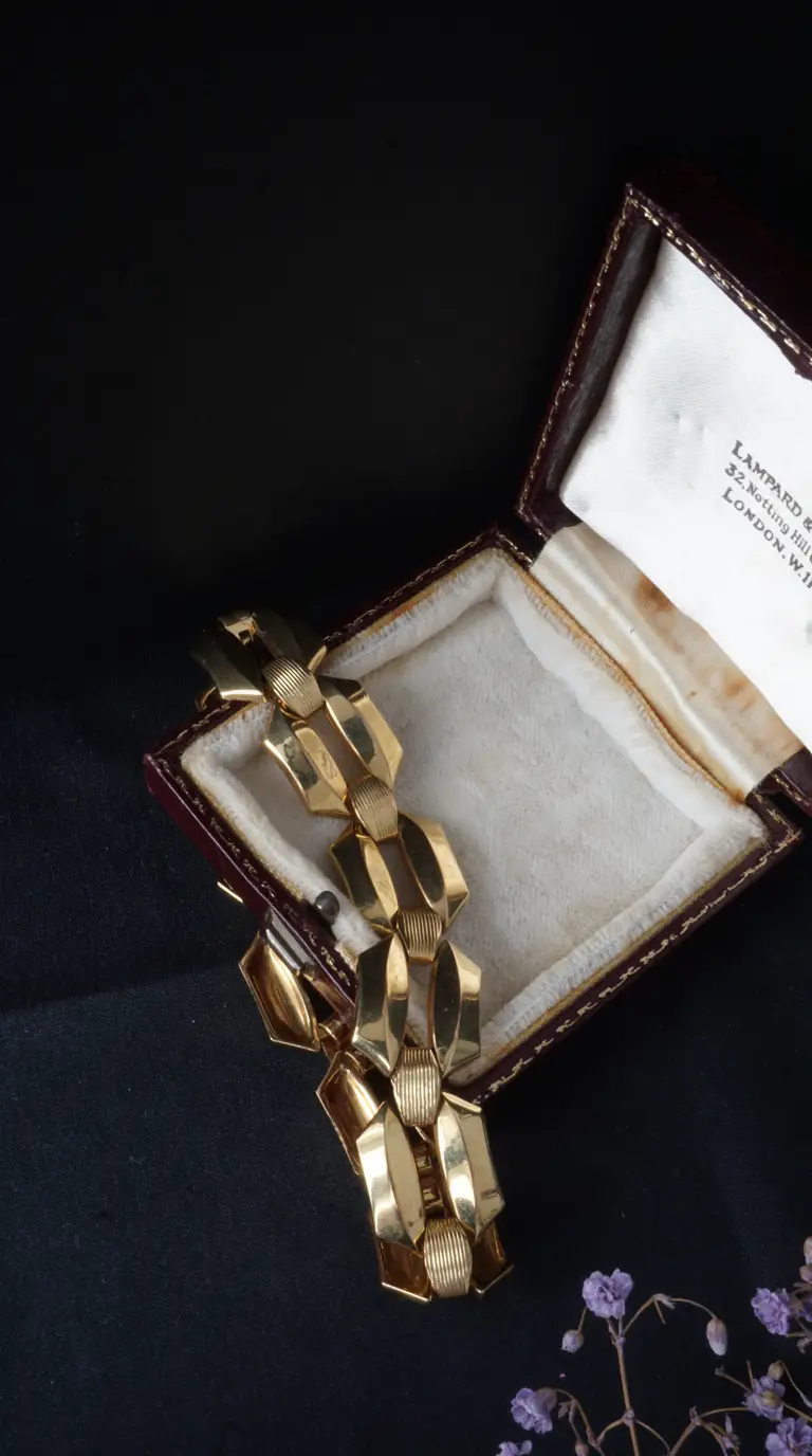 Vintage chunky gold geometric link bracelet in antique red leather jewelry box with London jeweler's mark.