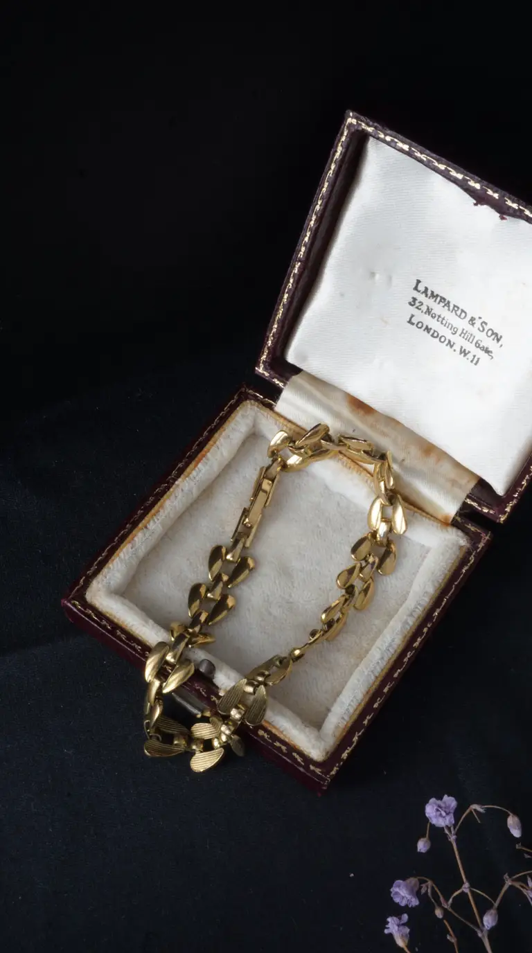 Vintage gold leaf link bracelet in open red Lampard & Son Notting Hill Gate London jewelry box