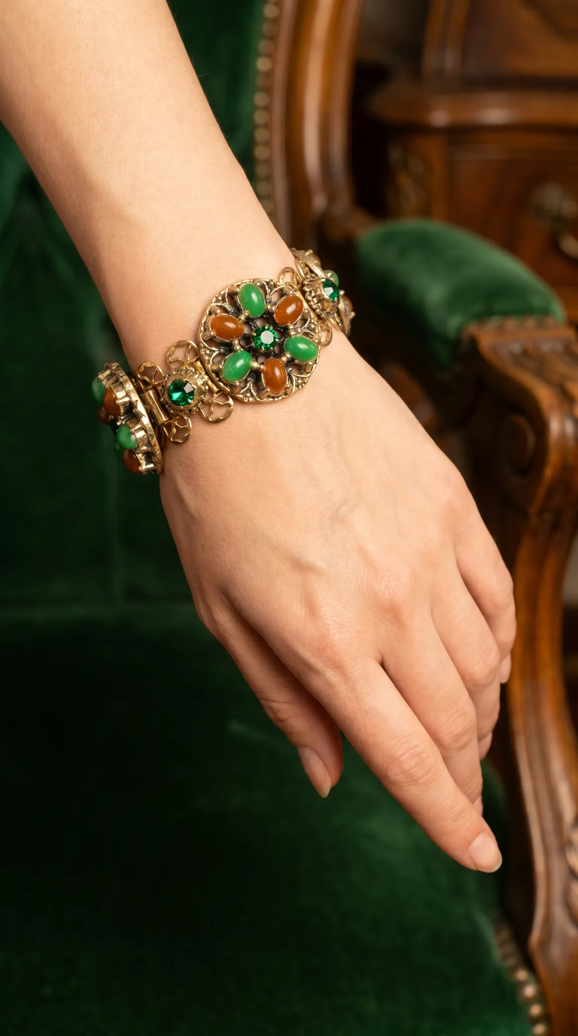 Vintage ornate gold-tone bracelet with green and amber cabochon gemstones