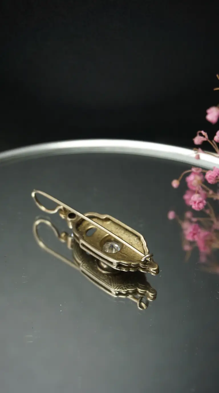 Vintage gold-tone ornate brooch with clear crystal, antique jewelry