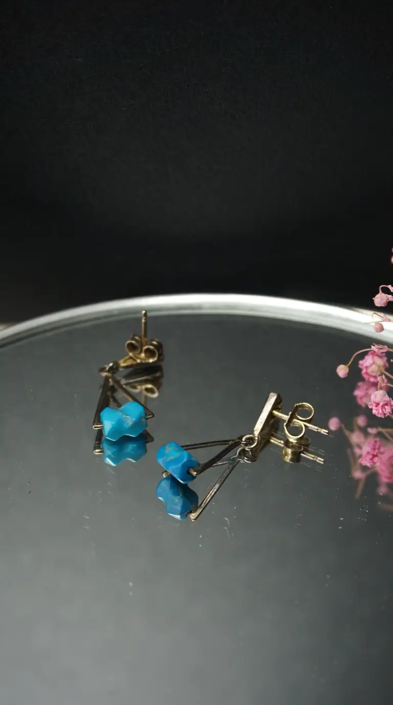 Vintage gold tone geometric dangle earrings with raw blue turquoise stones