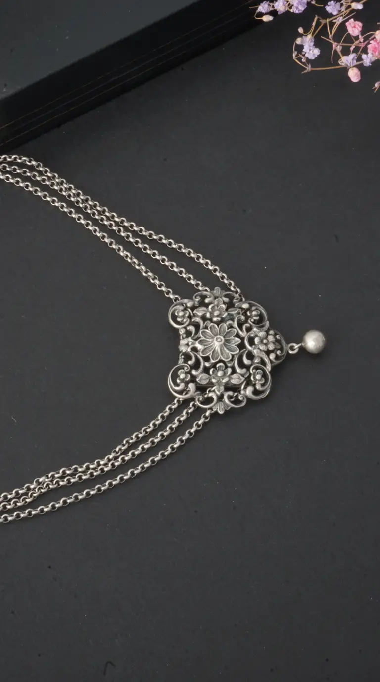 Vintage silver multi-chain necklace with ornate floral filigree pendant