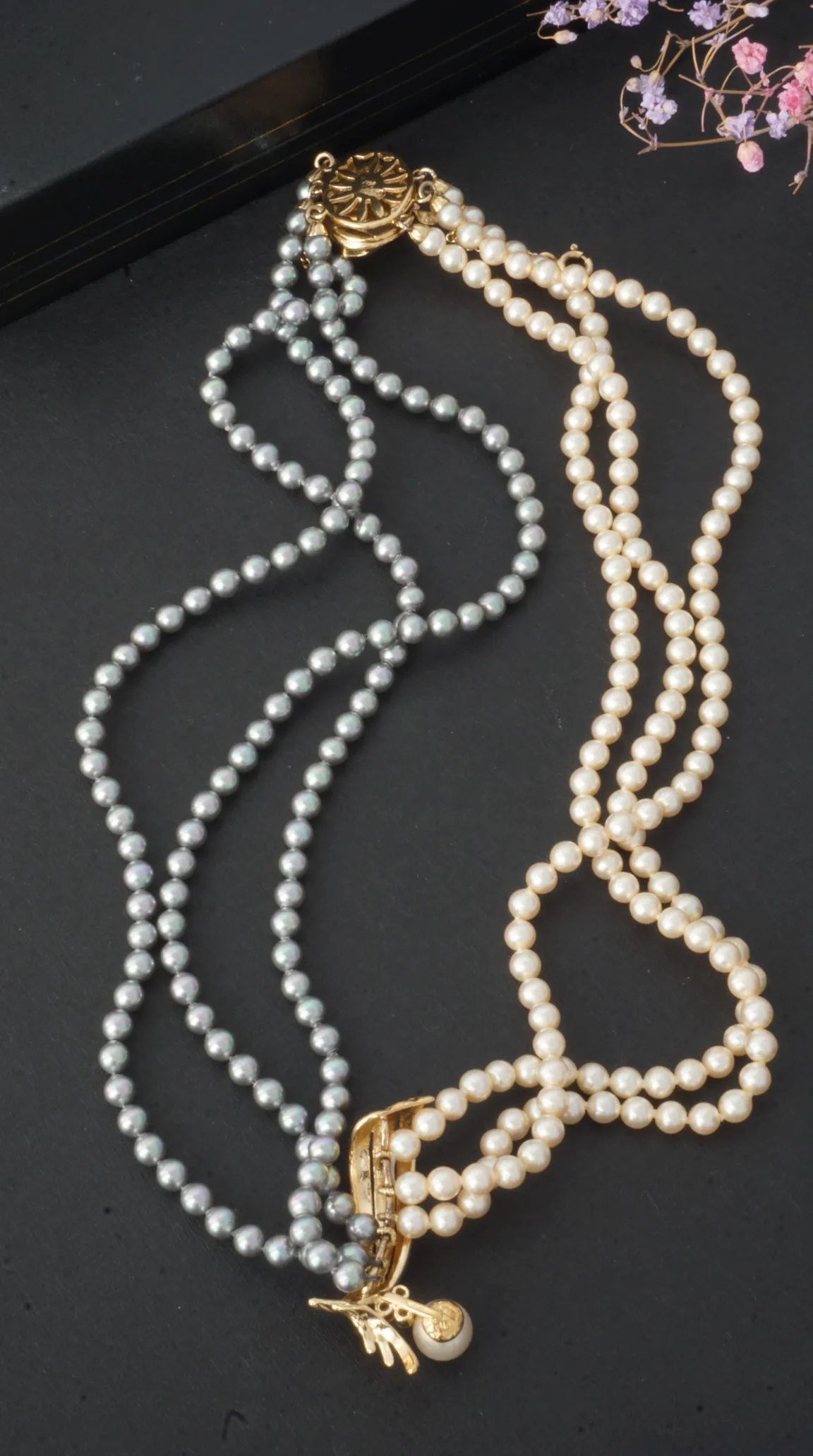 Vintage double strand grey pearl necklace and double strand cream pearl necklace with gold clasps.
