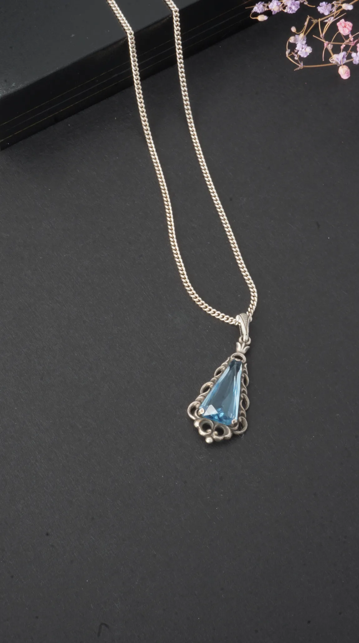 Vintage sterling silver necklace with ornate filigree triangular blue gemstone pendant