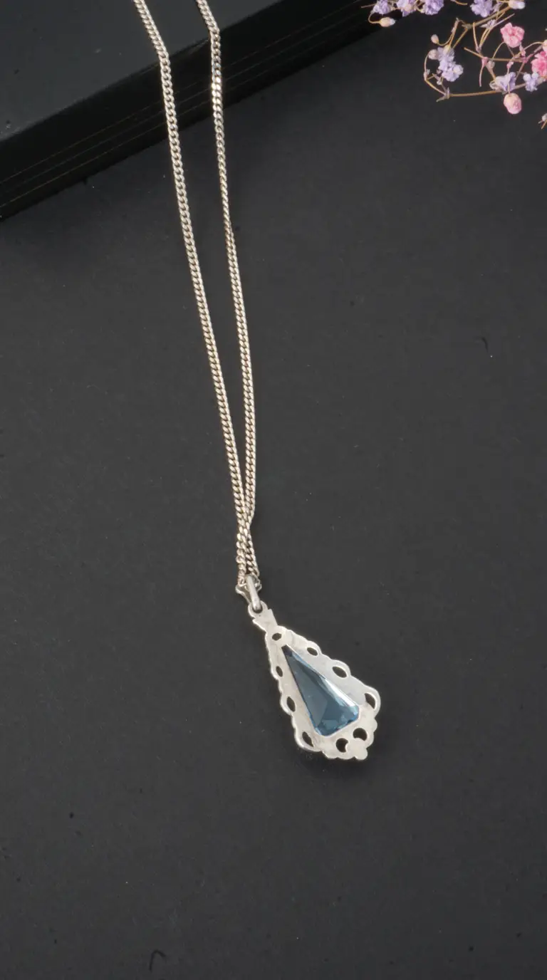 Vintage silver filigree necklace with blue triangular gemstone pendant