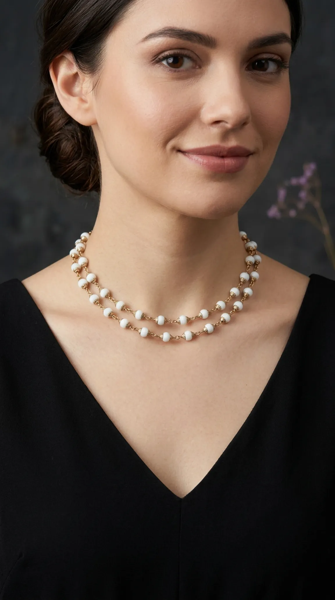 Vintage double strand white beaded gold chain necklace on a woman