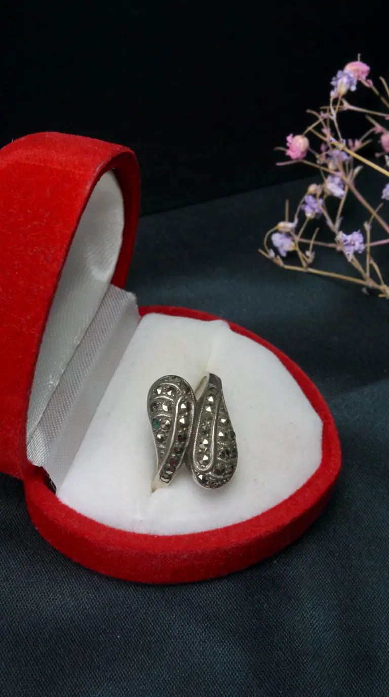 Vintage sterling silver marcasite ring with teardrop design in red velvet jewelry box