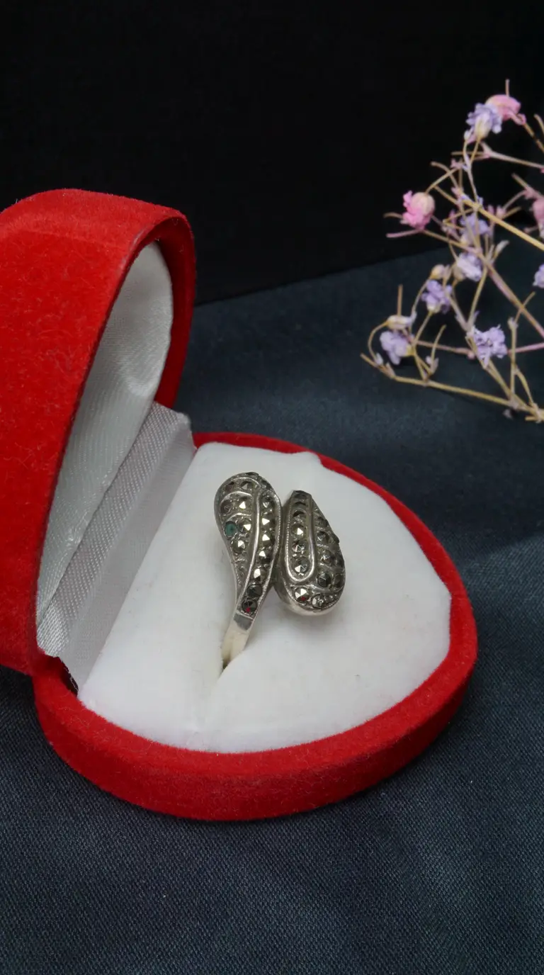 Vintage silver marcasite bypass ring in a red velvet heart-shaped box.