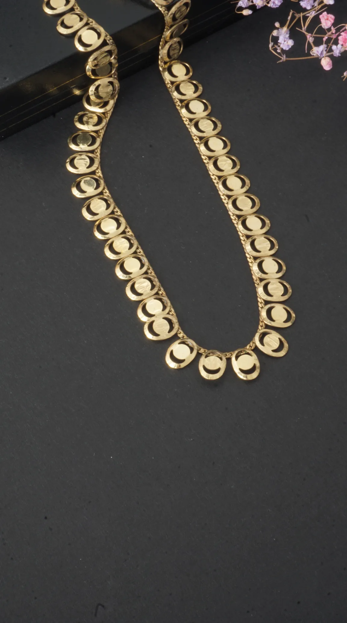 Vintage gold linked disc necklace with crescent cutouts