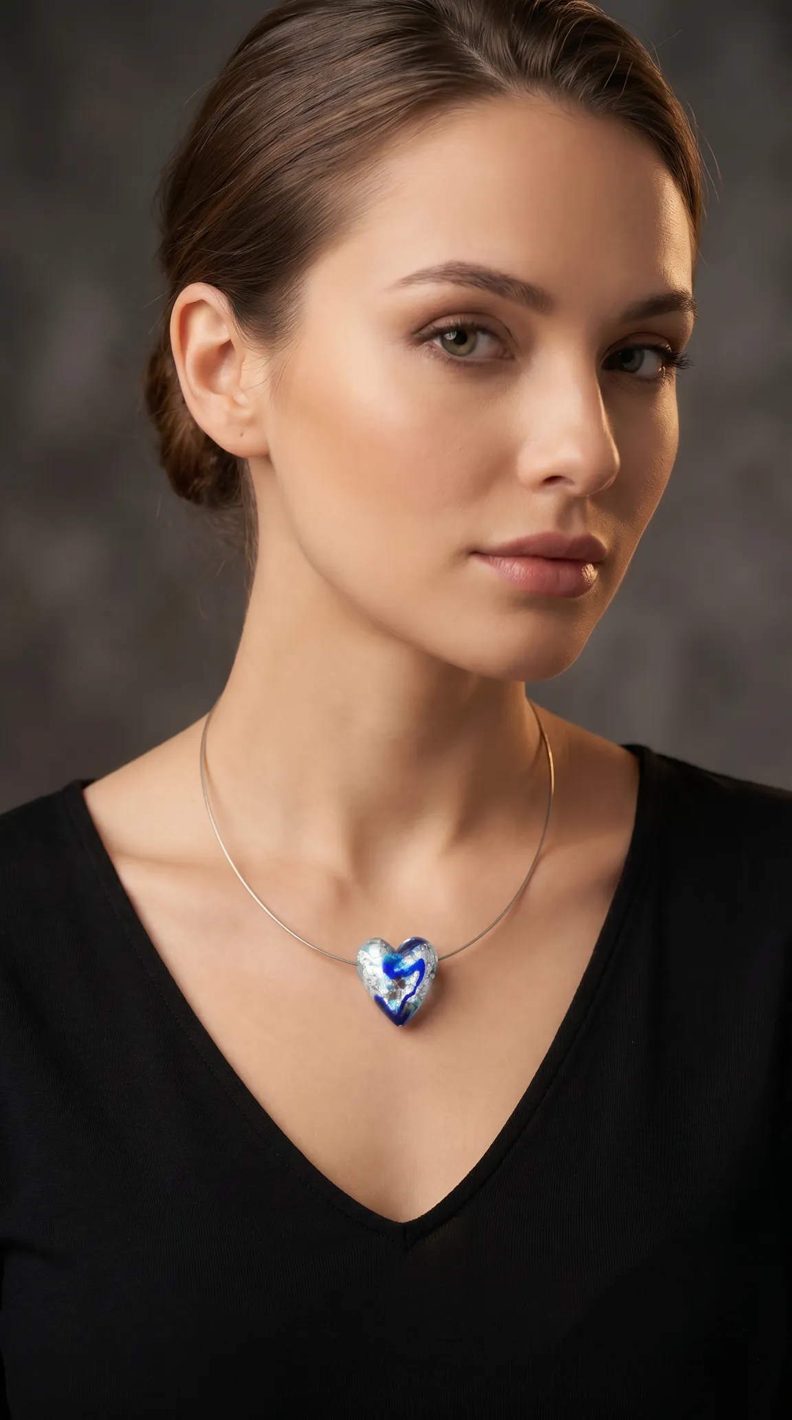 Vintage blue and silver art glass heart pendant choker necklace on a woman