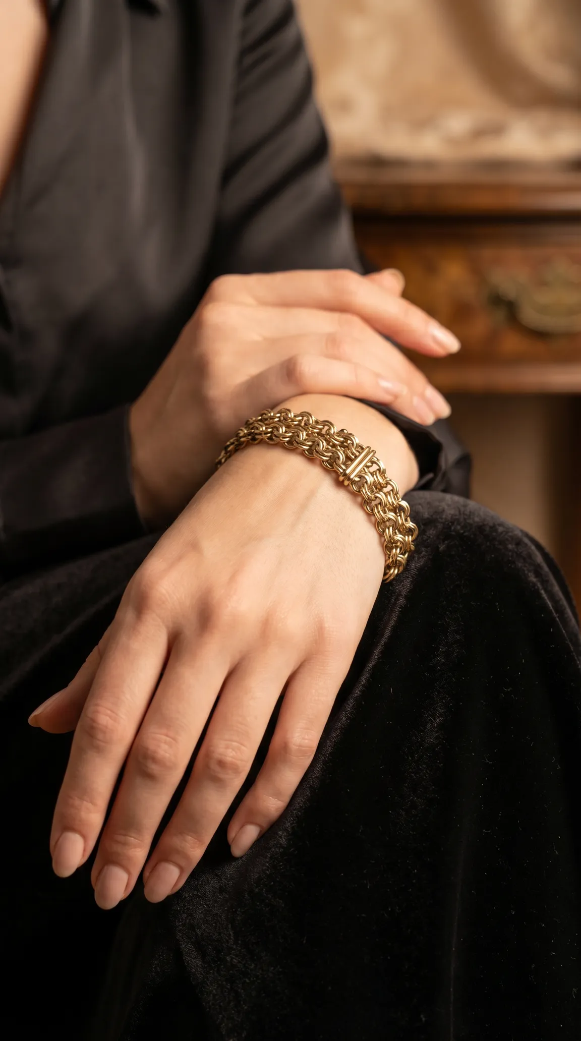 Vintage gold multi-row rolo chain bracelet on a woman's wrist