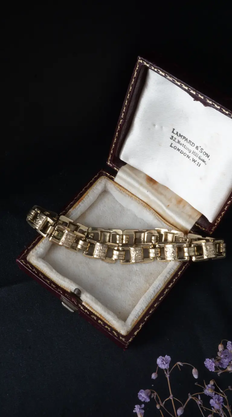 Vintage gold link bracelet with engraved details in antique Lampard & Son jewelry box