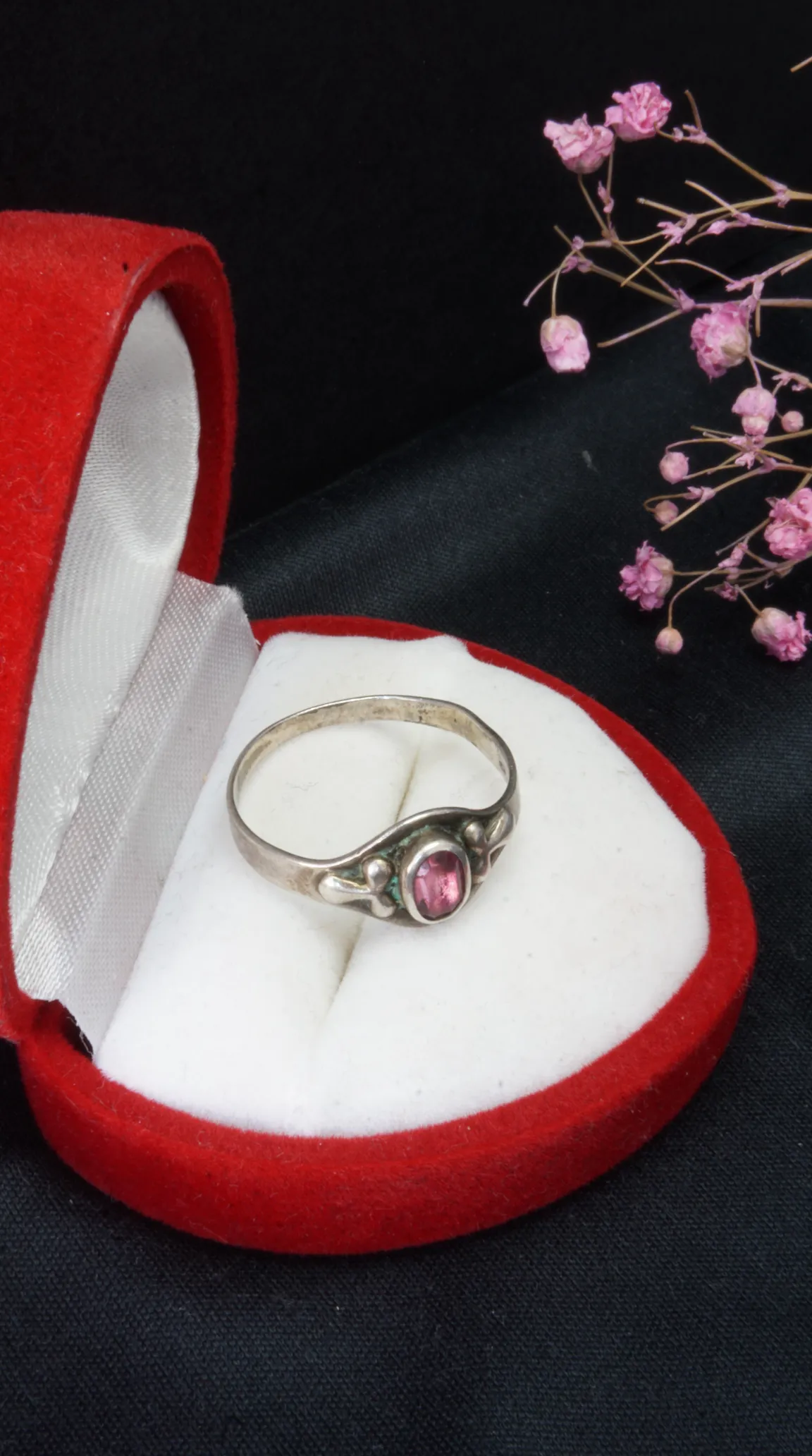 Vintage sterling silver ring with oval pink gemstone in red velvet heart box