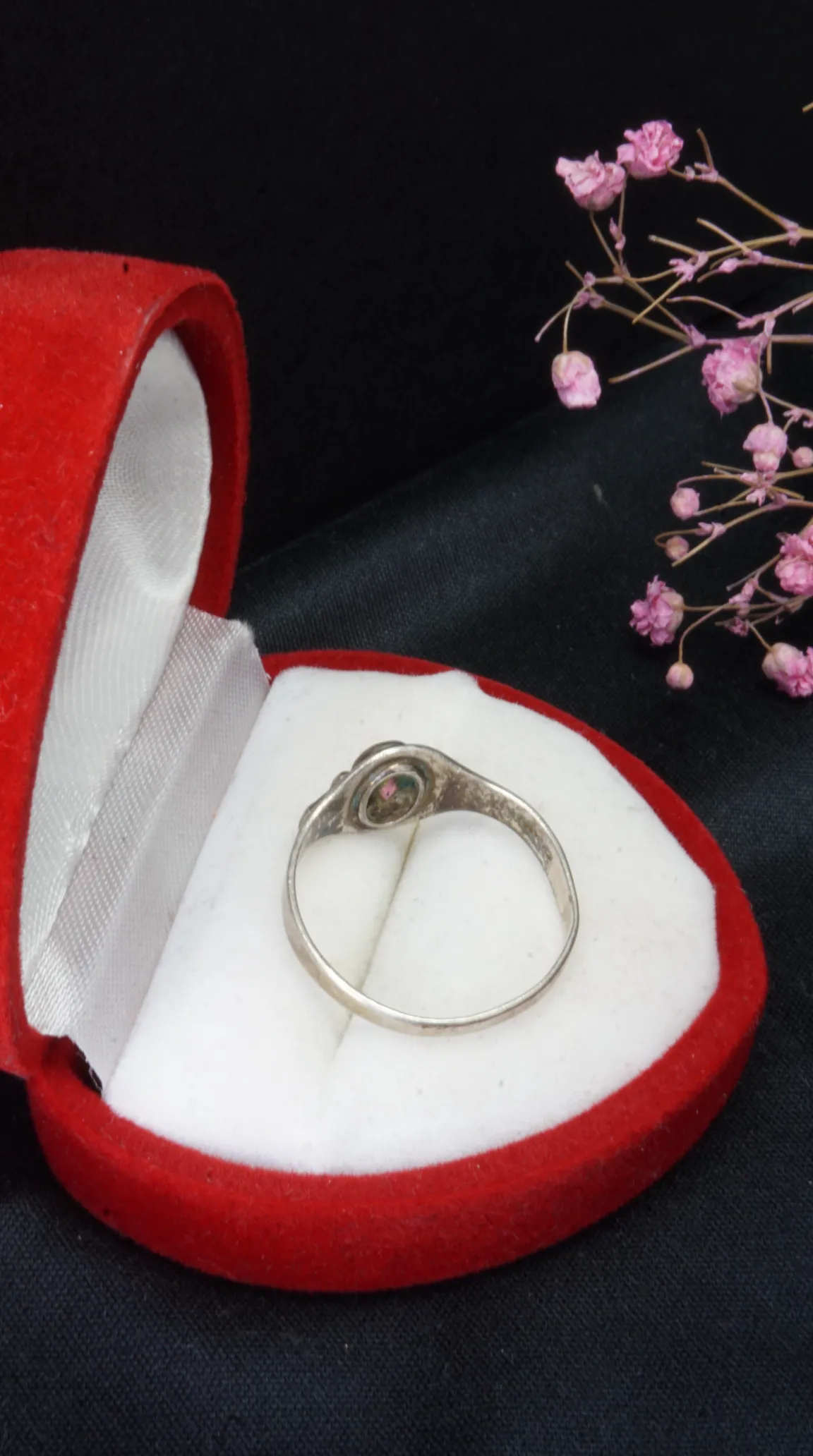 Vintage silver ring with pink gemstone in red velvet box