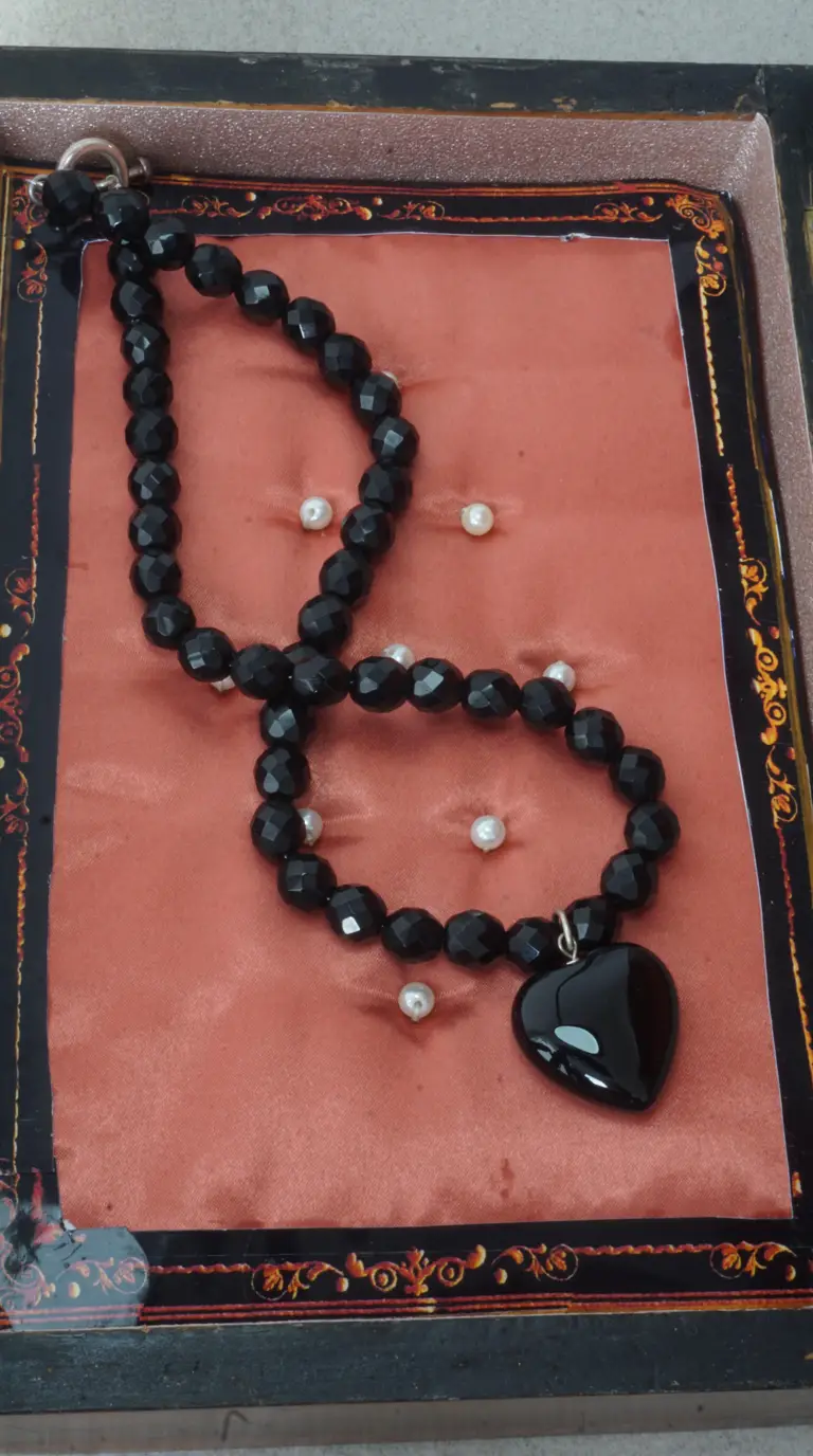 Vintage black faceted bead necklace with polished black heart pendant