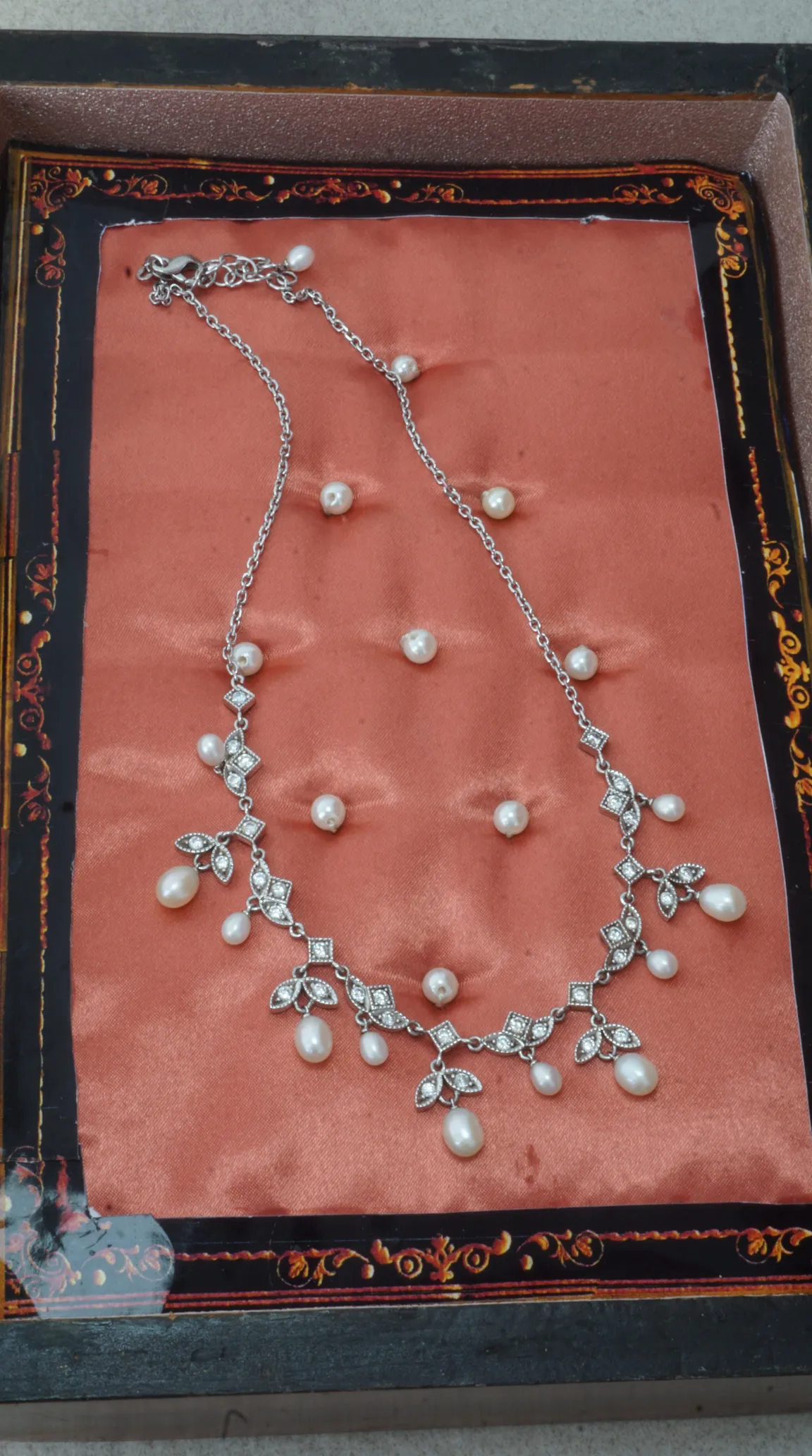Vintage sterling silver necklace with dangling freshwater pearls and sparkling rhinestone floral and geometric accents