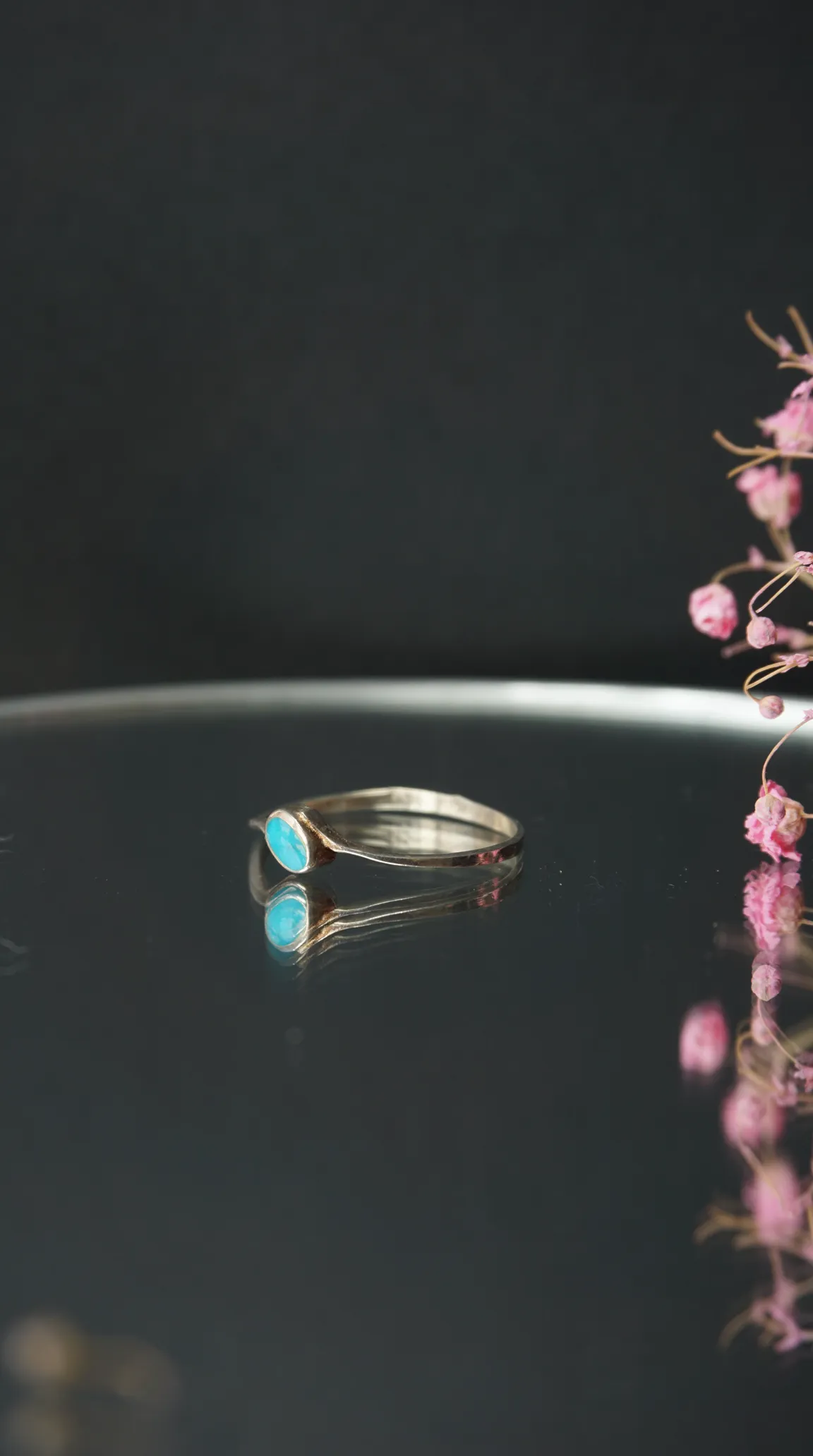 Vintage silver ring with oval turquoise gemstone.